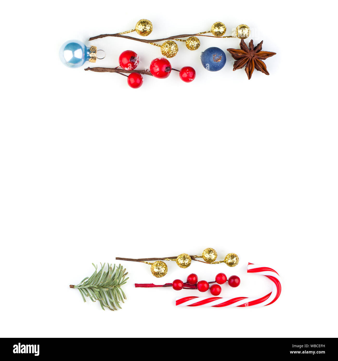 Beautiful Christmas border with red holly berries, baubles and green ...