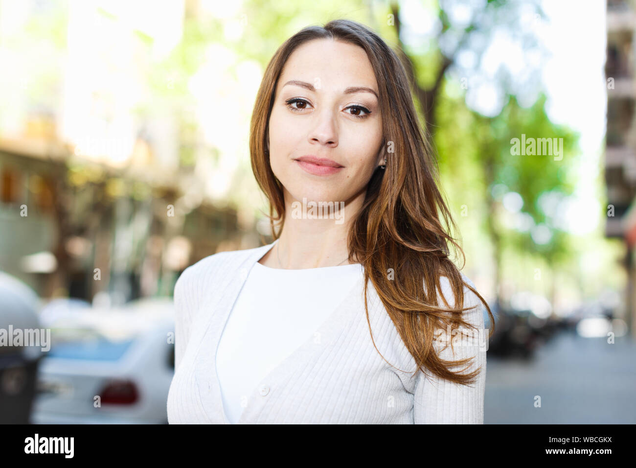 Portrait of stylish young woman walking city street in summer day Stock ...