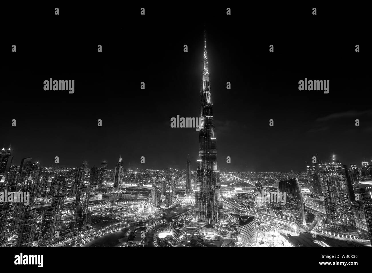 Burj Khalifa at night on the city of Dubai skyline in black and white Stock Photo