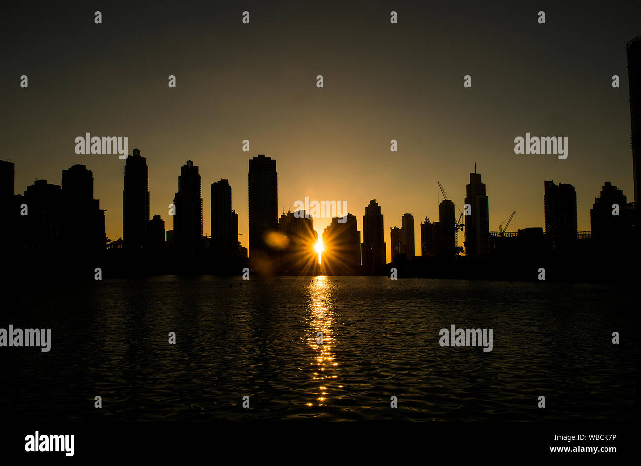 Sunset on the skyline of the city of Dubai Stock Photo