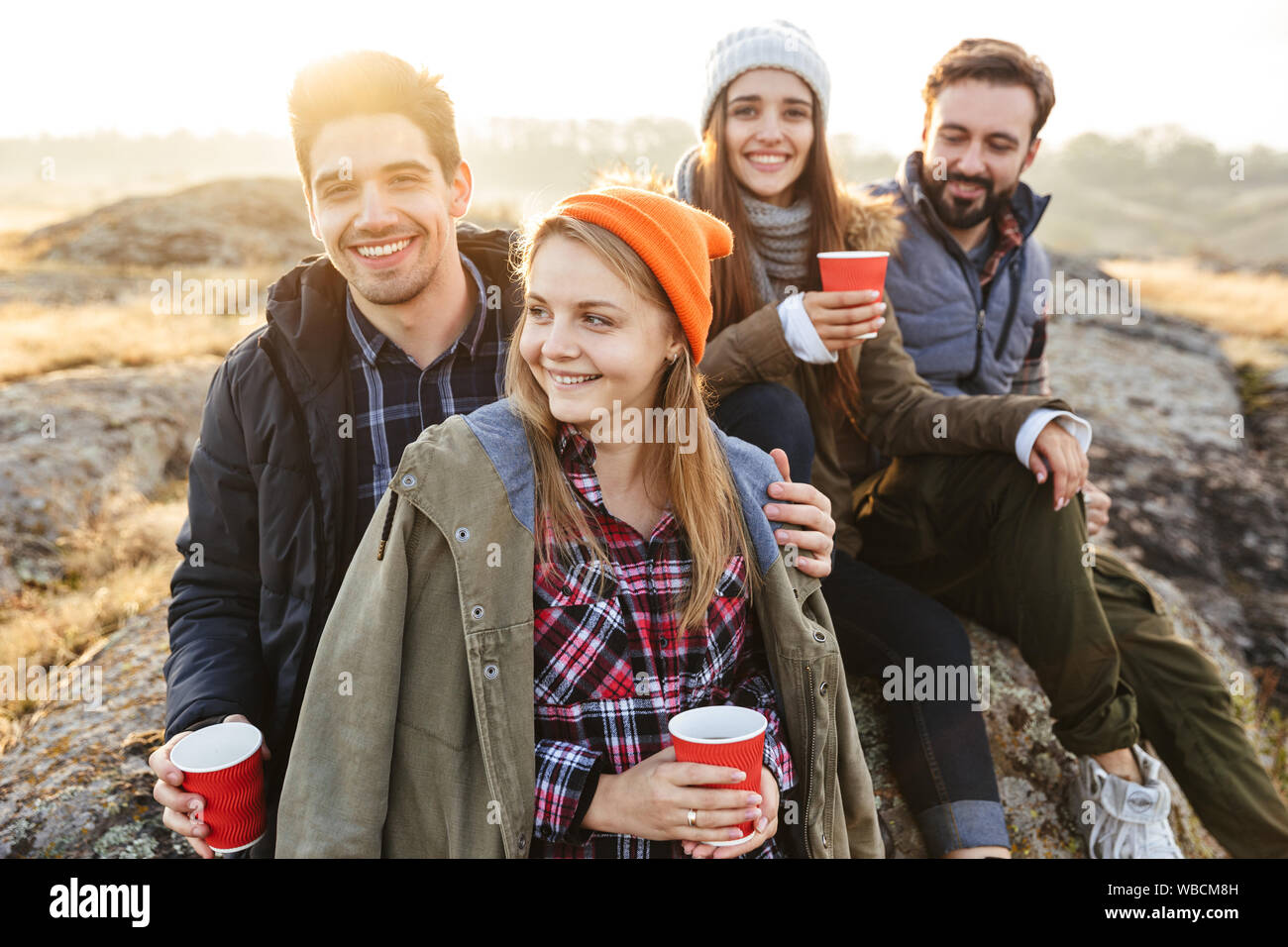 Group friends drinking outside tent hi-res stock photography and images ...