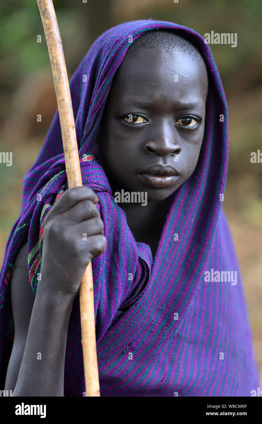 Young tribal Suri boy at a ceremony in Lower Omo Valley near Kibish ...