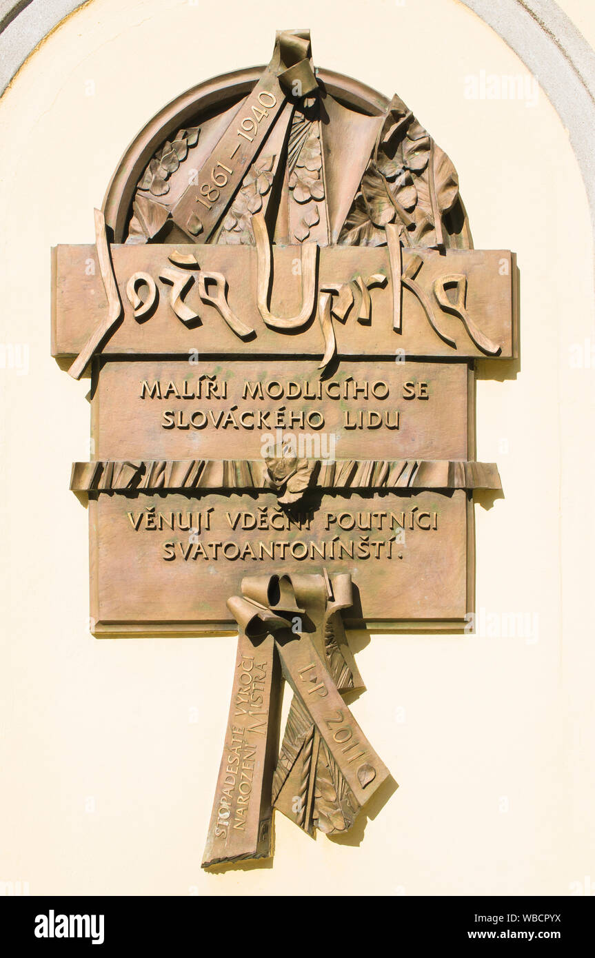 The memorial plaque to Czech painter and graphic artist Joza Uprka on a wall of chapell of Saint Anthony of Padua, pilgrimage place, Blatnice pod Svat Stock Photo
