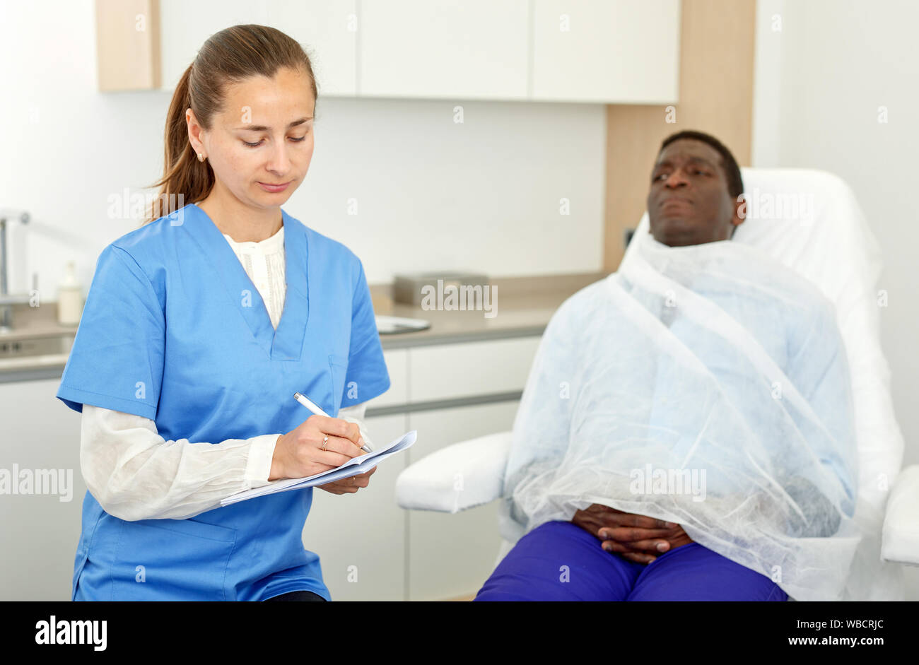 Female patient signing medical papers hi-res stock photography and ...