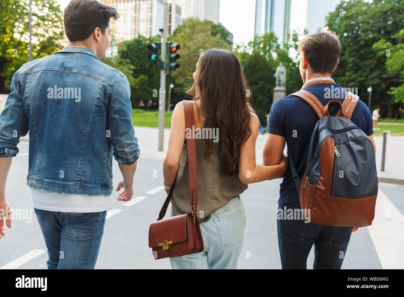 Back view couple walking arms hi-res stock photography and images - Alamy