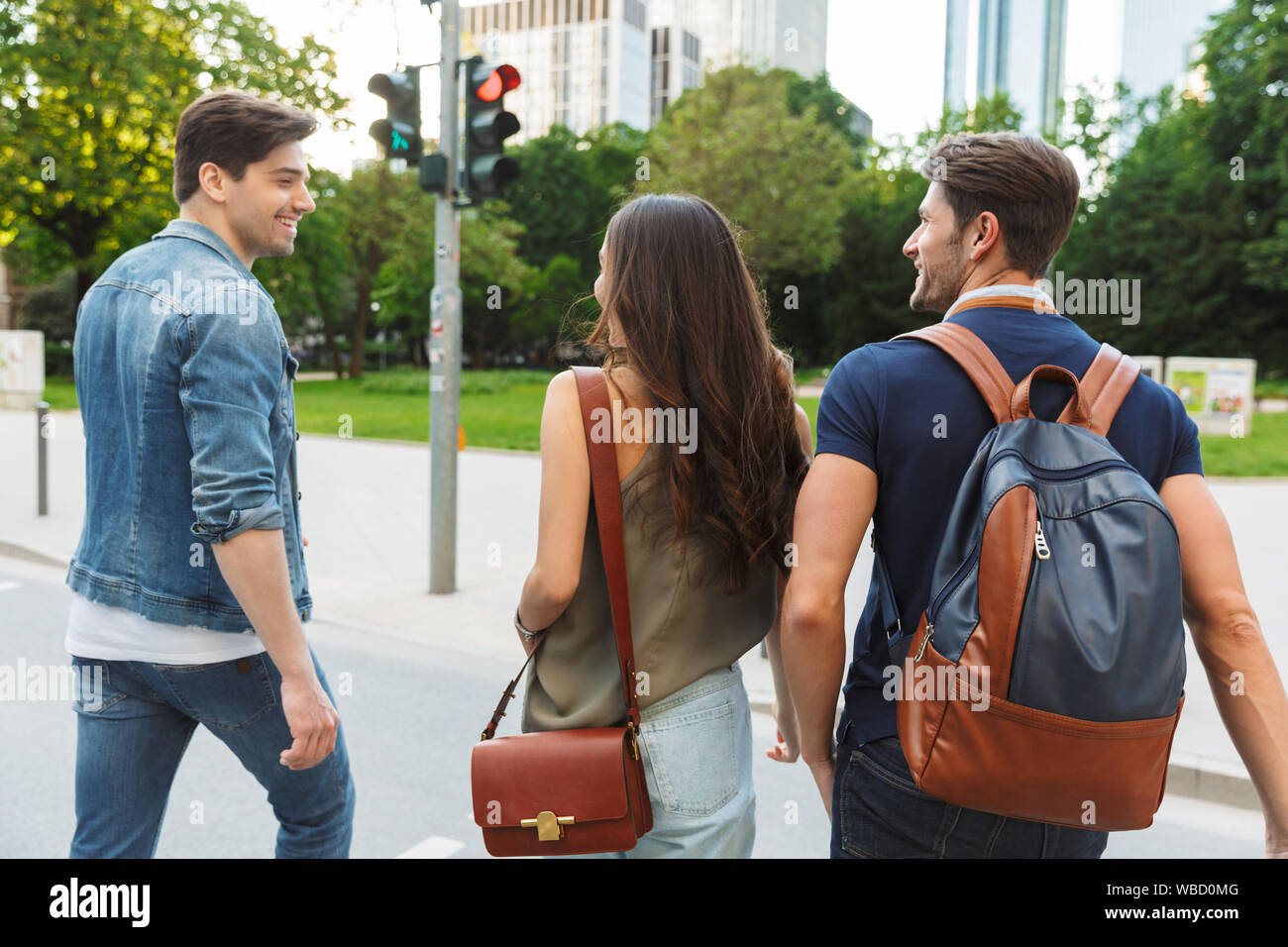 Back view couple walking arms hi-res stock photography and images - Alamy