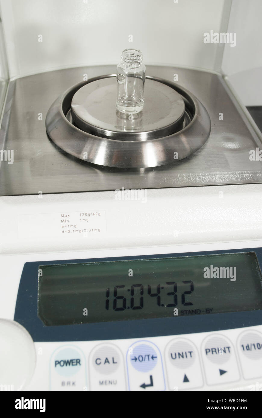 Weighing machine with empty test tube. Chemical pharmaceutical laboratory. Concept of research in medicine. Process of the developing a vaccine. Stock Photo