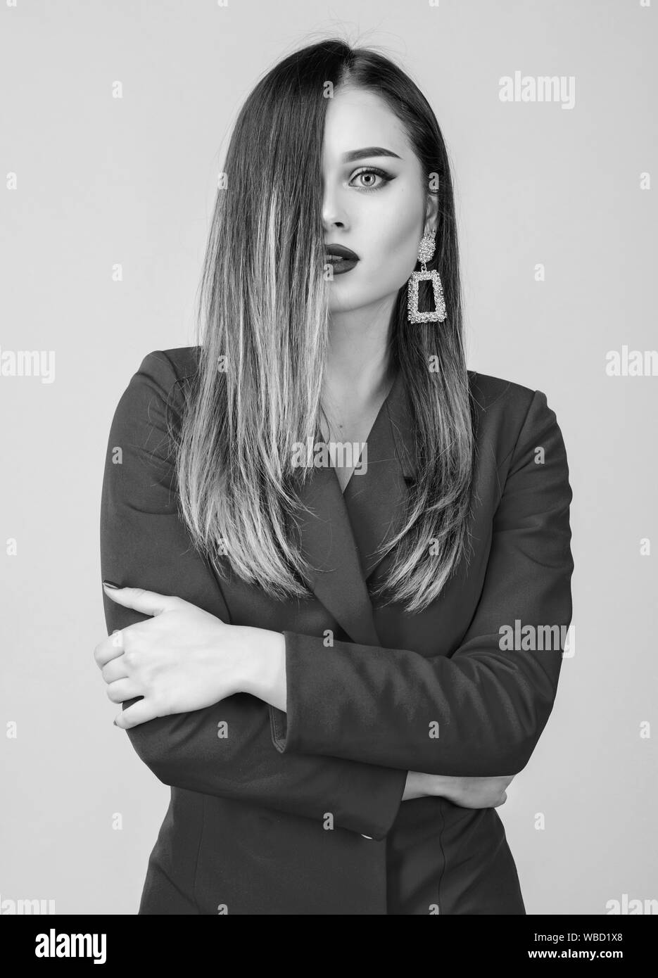 Woman wear glamorous earrings. Hairstyle and hairdresser. Ombre hair