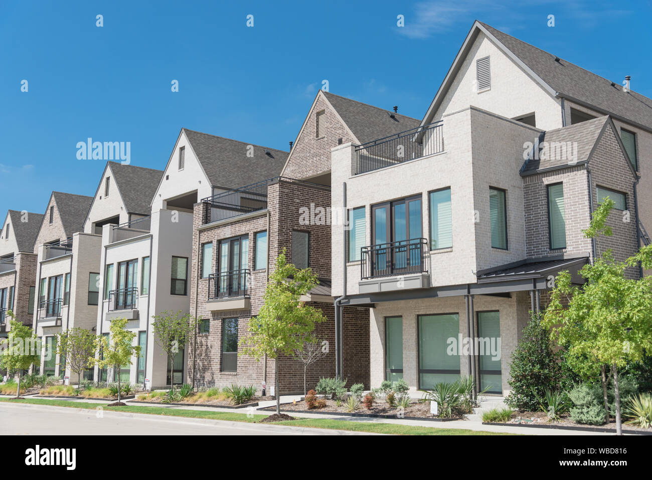 Modern porch of new development three story single family houses near