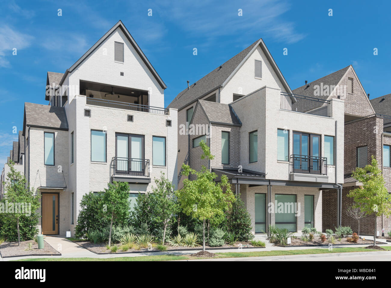 Modern porch of new development three story single family houses near
