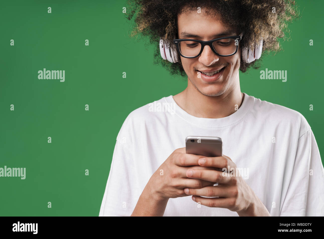 Smiling afro man headphones using hi-res stock photography and images ...