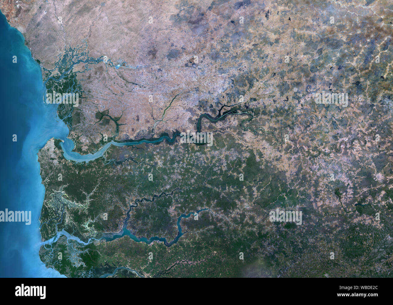 Color satellite image of Gambia. The country is situated on both sides of the Gambia River. This image was compiled from data acquired by Sentinel-2 & Landsat 8 satellites. Stock Photo
