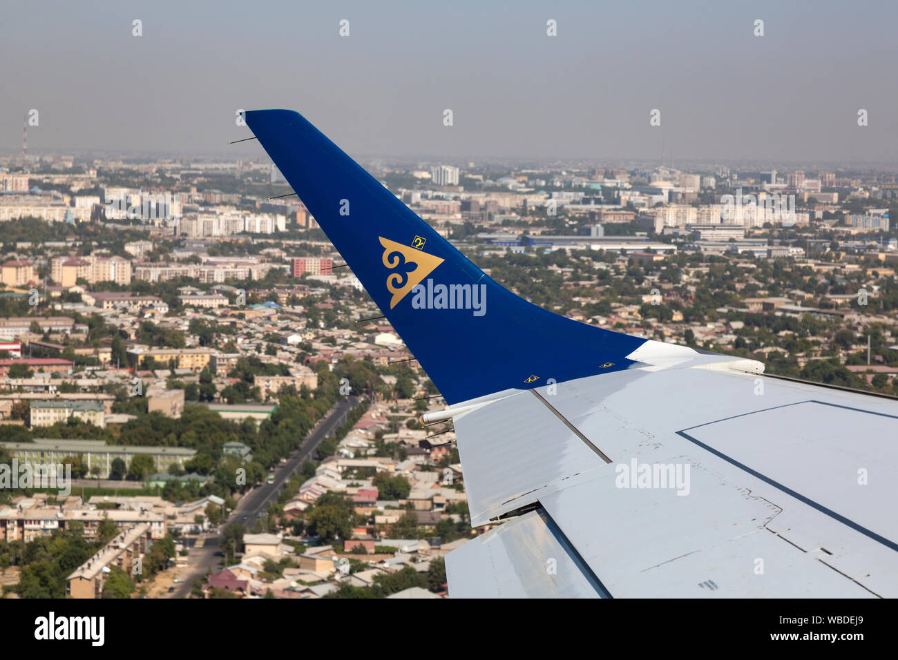 View over the wing of an Air Astana plane as it lands at Nursultan Nazarbayev International Airport  in  Kazakhstan. Stock Photo