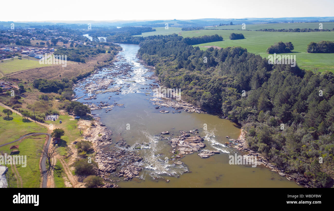 Flight over the Tibagi river in the Tibagi city of Parana state, Brazil. Stock Photo