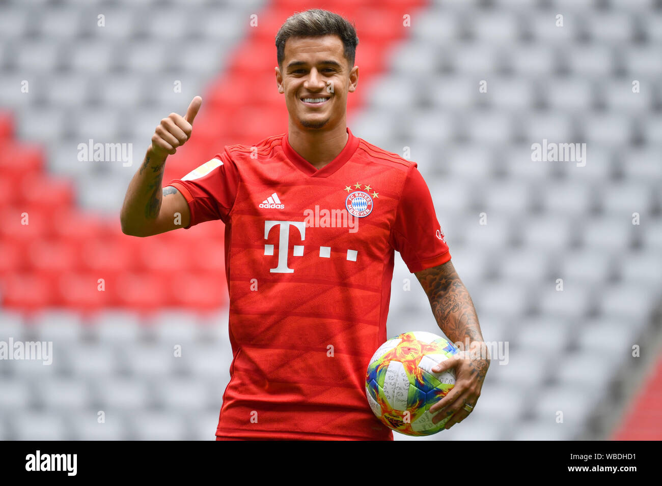 Munich, Deutschland. 19th Aug, 2019. Philippe COUTINHO (Bayern Munich)  wearing a jersey, posing in the stadium. thumb up, thumbs up. Action,  single image, single cut motif, half figure, half figure, official  performance,