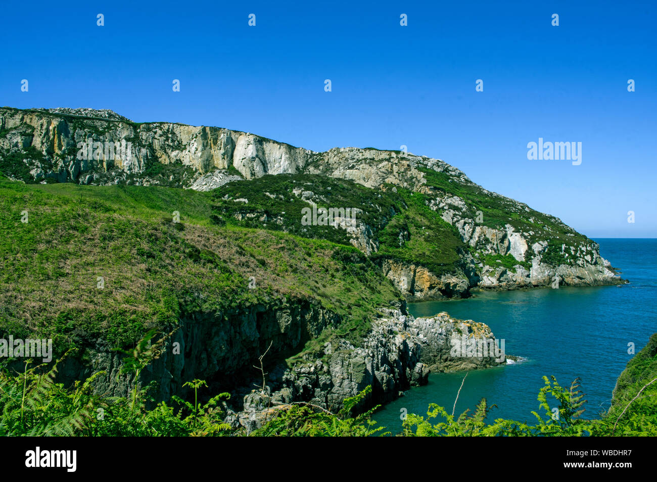A bay at the base of Holyhead Mountain Stock Photo Alamy