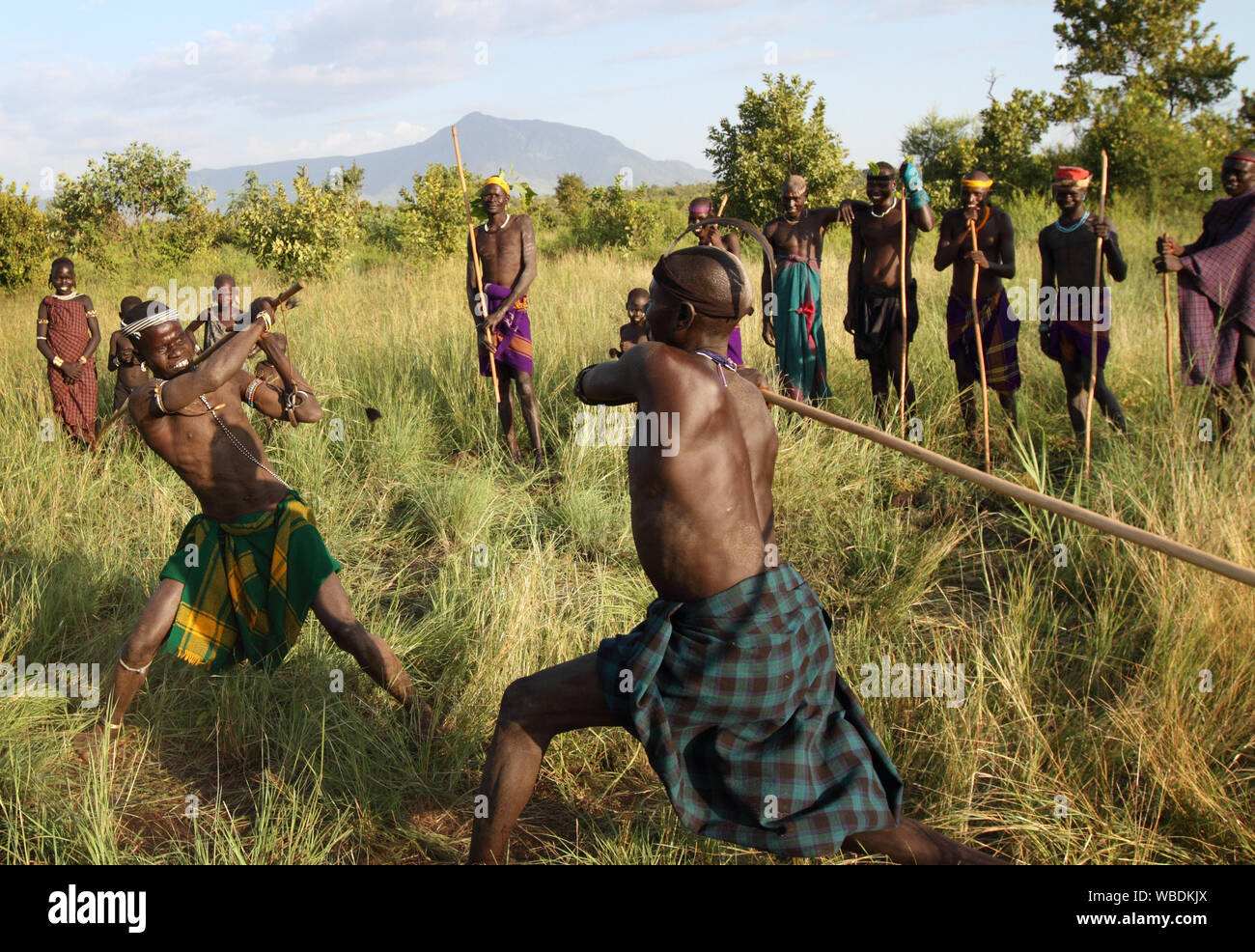 Mursi warriors during a stick fight in Mago National Park, Lower Omo Valley, Ethiopia Stock Photo