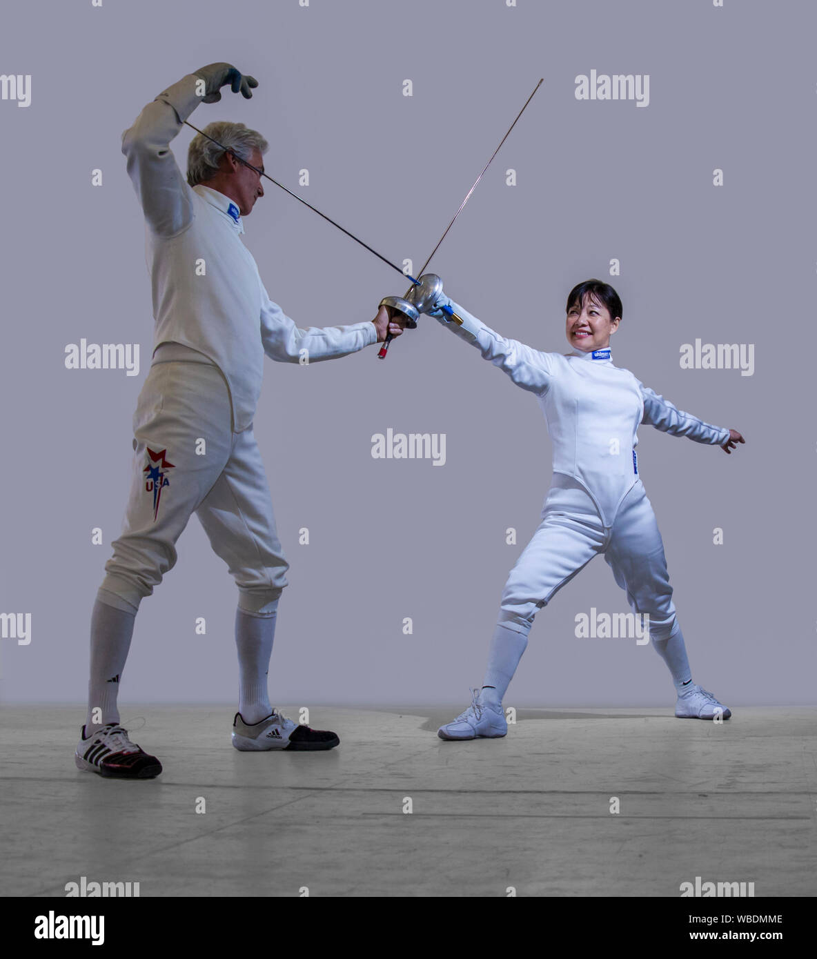 Two fencers show the En Garde opening pose in Oakland, Calif on Mar 20