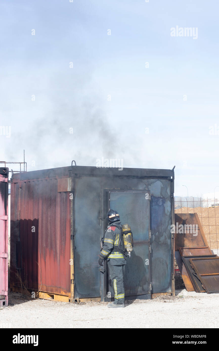 Firefighter putting out fire training station extinguisher backdraft ...