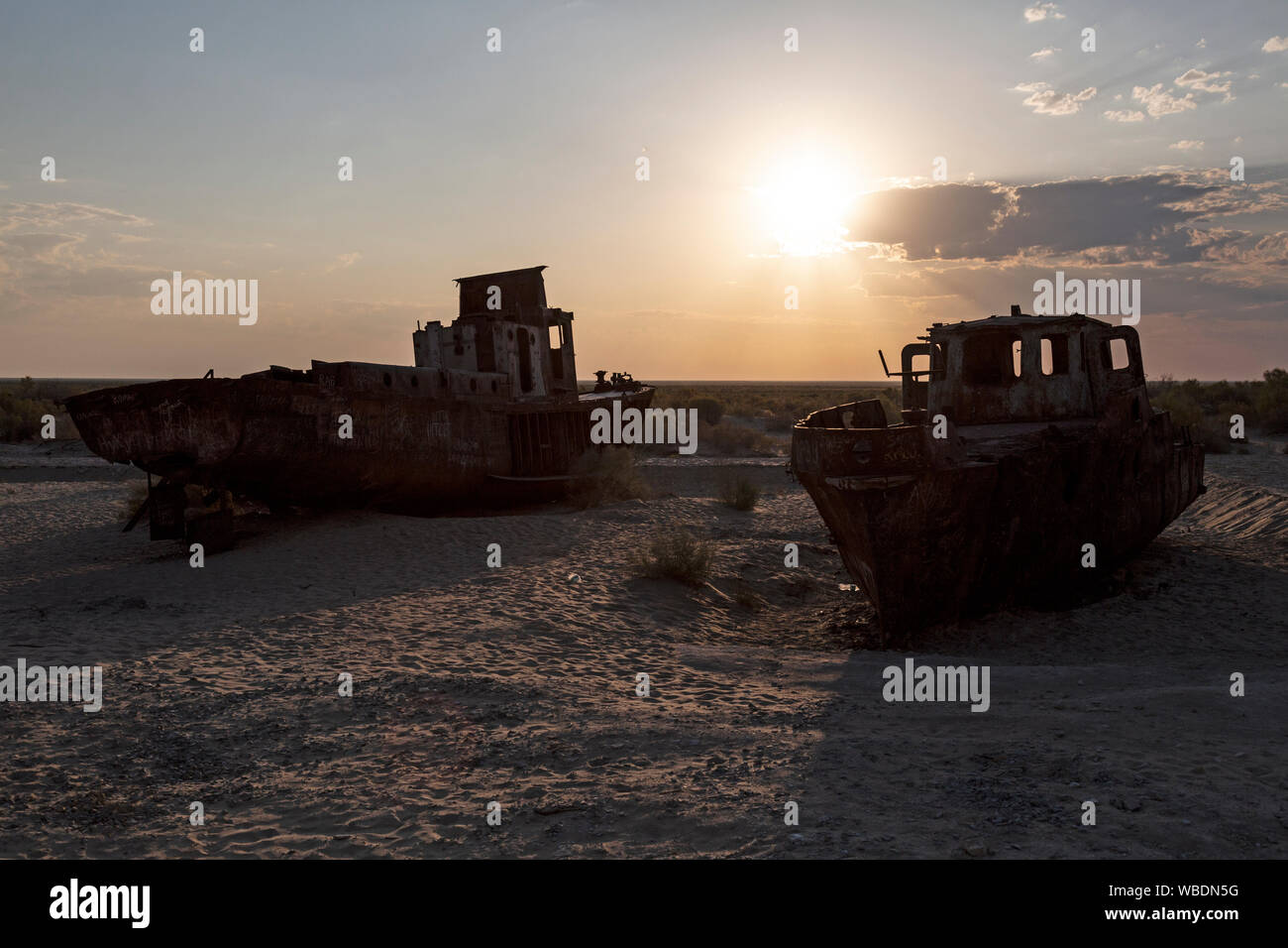 Moynaq, or Muynak, in Uzbekistan. Rusting boats in the desert that used to be part of the Aral Sea, which was almost completely emptied by the Soviets. Stock Photo