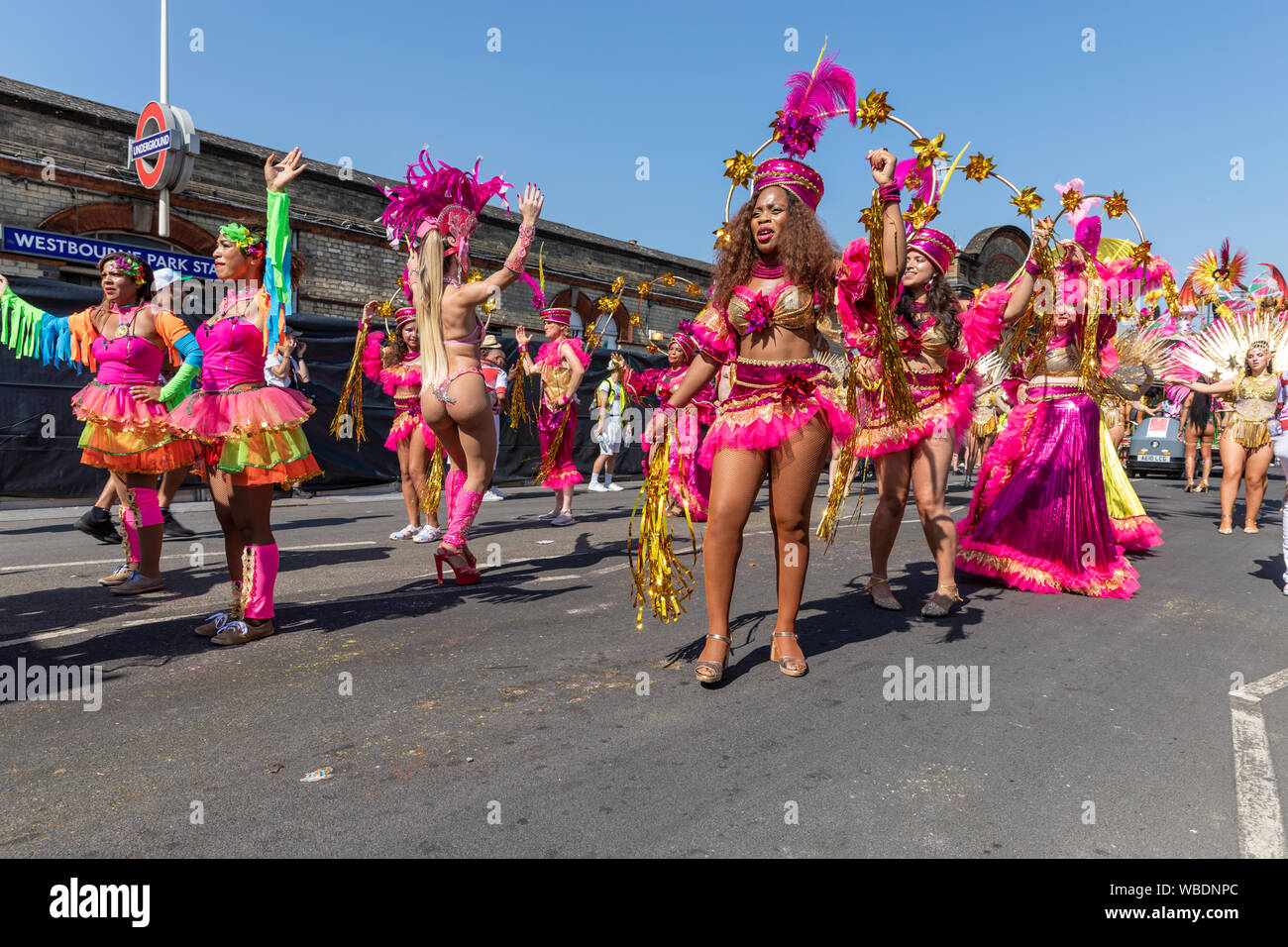 A carnival troupe performing on a city street, in Westbourne Road during  the Notting Hill Carnival in August 2019 Stock Photo - Alamy