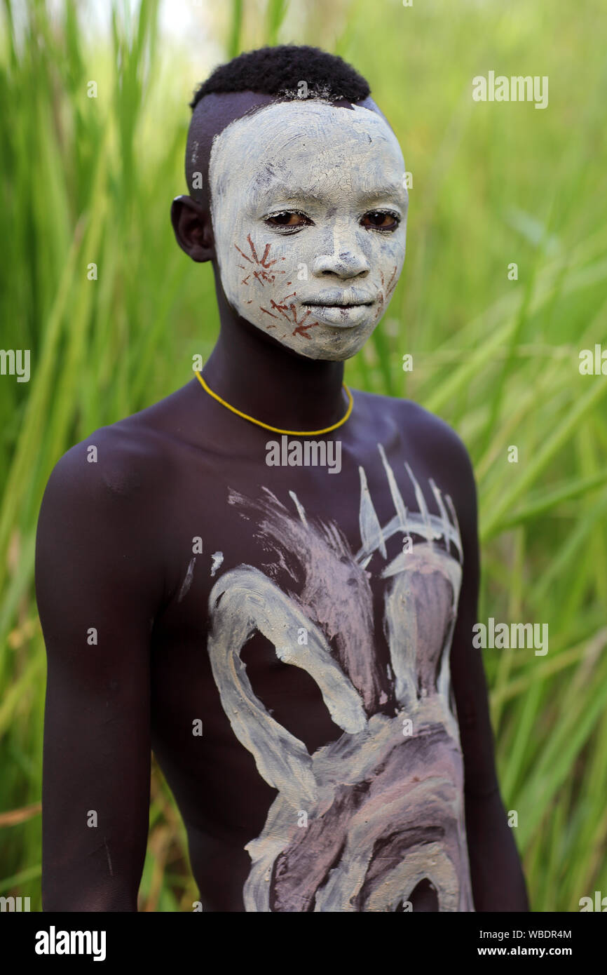 Young tribal Suri boy at a ceremony in Lower Omo Valley near Kibish, Ethiopia Stock Photo