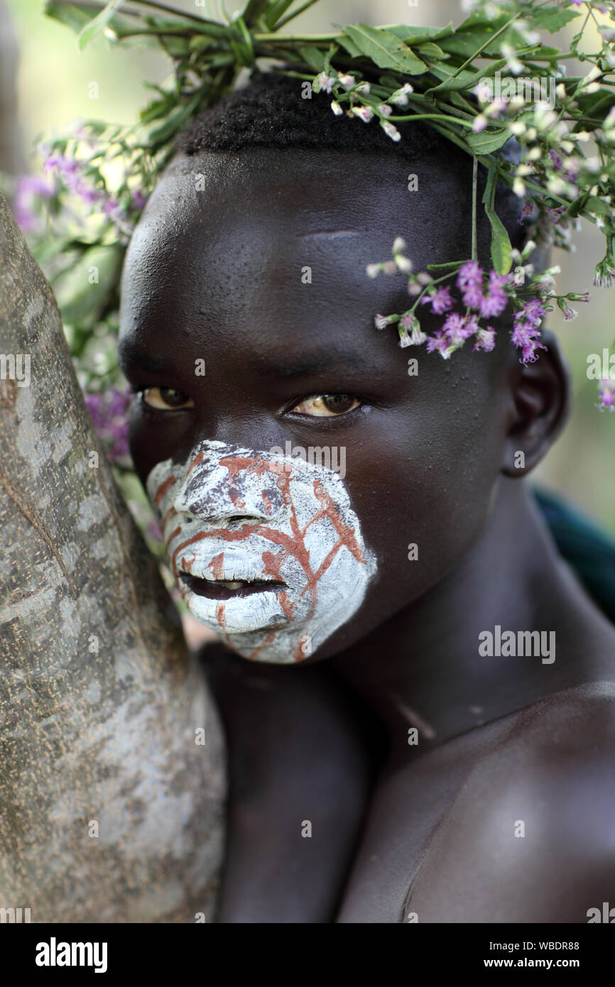 Young tribal Suri boy at a ceremony in Lower Omo Valley near Kibish, Ethiopia Stock Photo