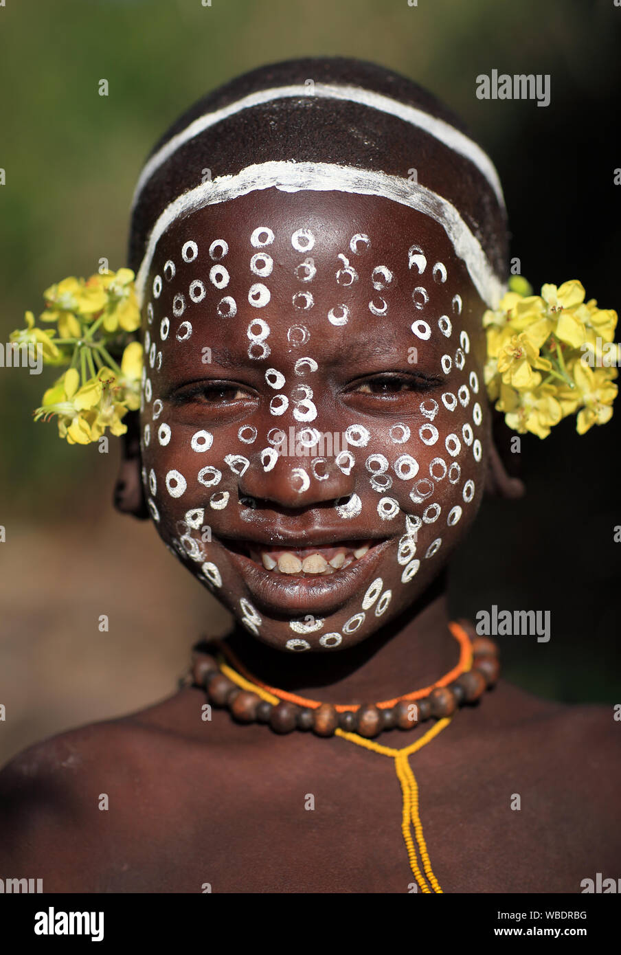 Beautiful tribal Suri girl at a ceremony in Lower Omo Valley near Kibish, Ethiopia Stock Photo