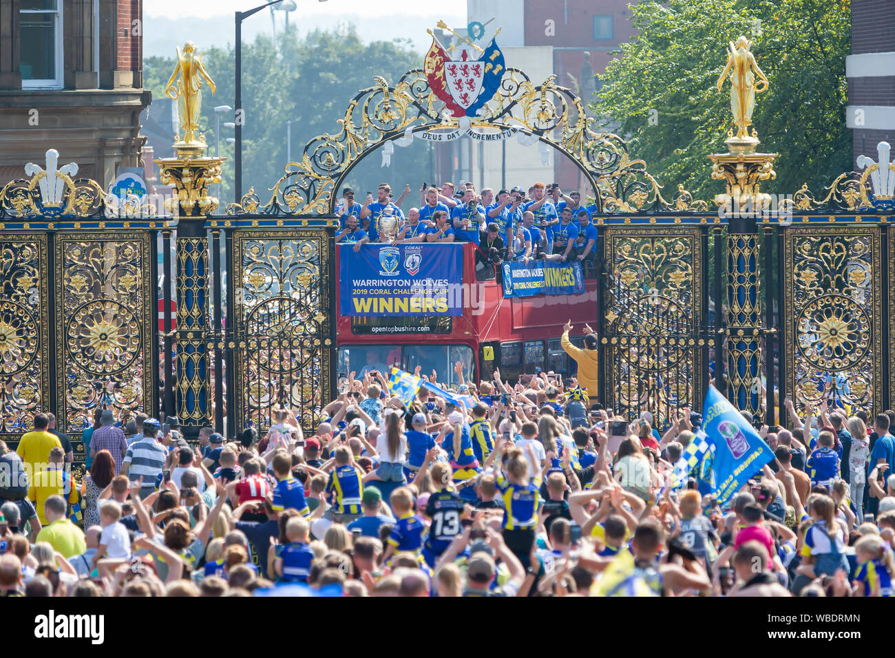 Warrington, UK. 26th Aug, 2019. Warrington bring the Coral Challlenge Cup back home - the open-top bus travels past the Golden Gates of the Town Hall Credit: John Hopkins/Alamy Live News Stock Photo