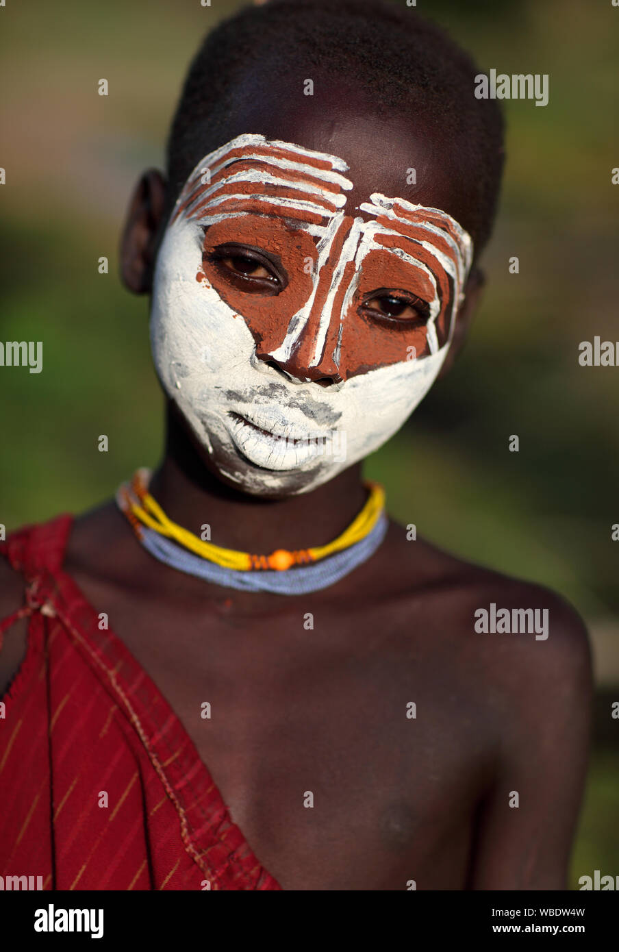 Beautiful tribal Suri girl at a ceremony in Lower Omo Valley near