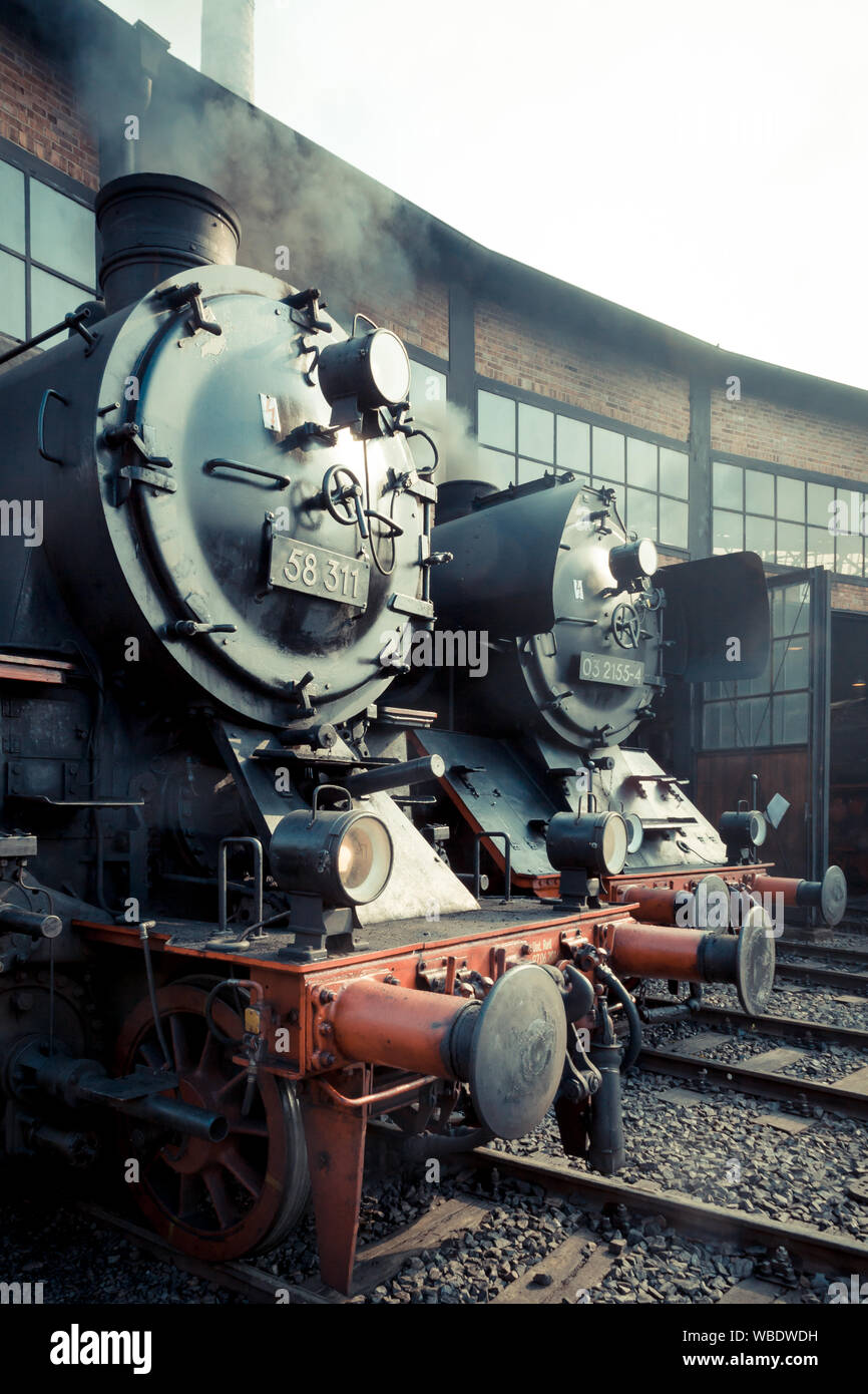 Old steam locomotive in a depot Stock Photo