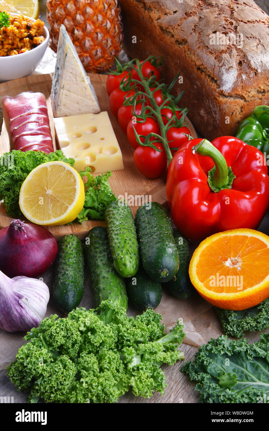 Composition with assorted food products on kitchen table Stock Photo