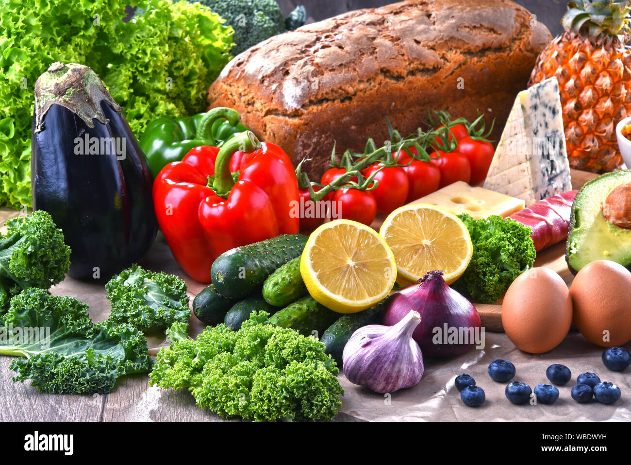 Composition with assorted food products on kitchen table Stock Photo