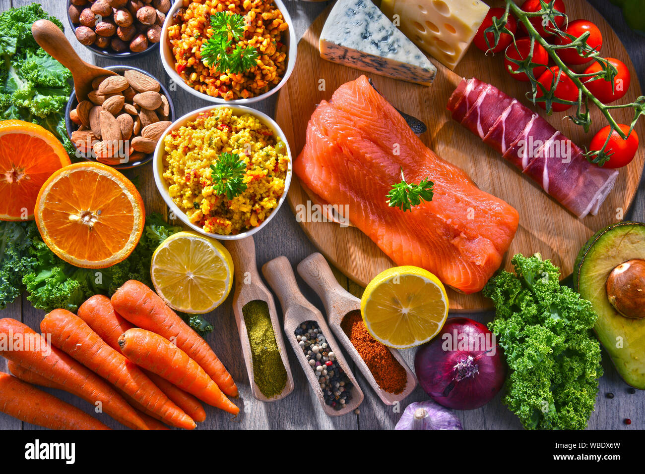 Composition with assorted food products on kitchen table Stock Photo Alamy
