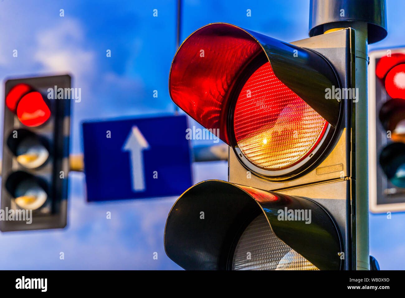 Traffic lights over urban intersection. Red light Stock Photo - Alamy