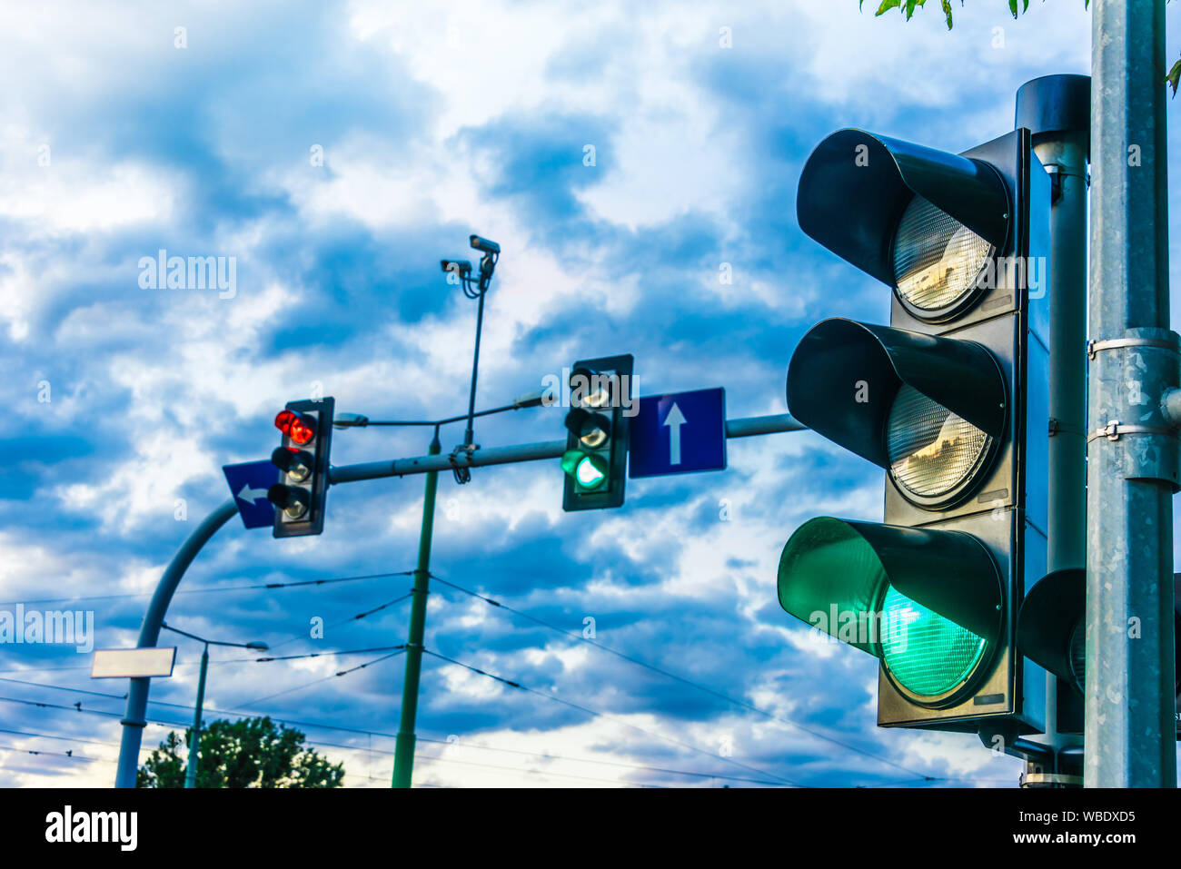 Traffic lights over urban intersection. Green light Stock Photo Alamy