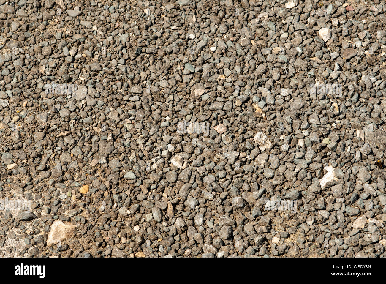 Trampled fine gravel on a walkway near the riverbank. Background. Stock Photo