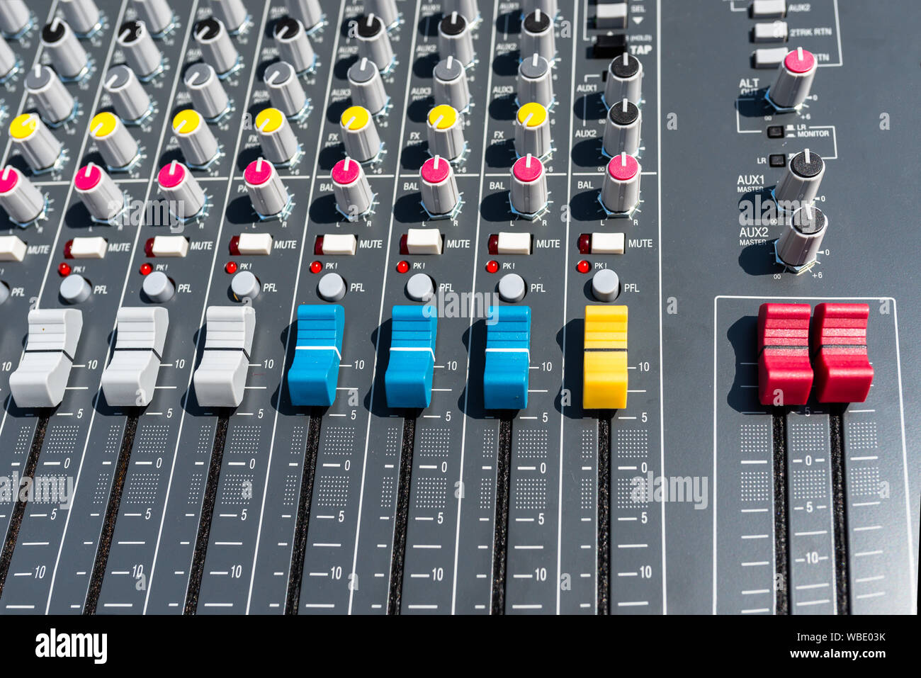 Close up photo of a professional sound mixer with many adjustments, knob  switches and buttons of audio mixer control panel Stock Photo - Alamy