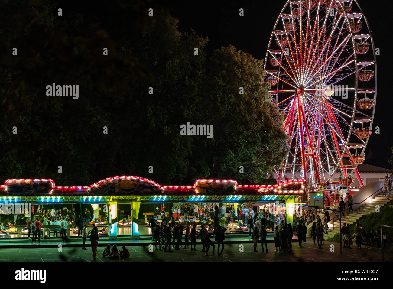 Stadtfest Brugg 24th of august 2019. street photography. Lunapark at night with illuminated spinning wheel and autosooter in Brugg. Stock Photo