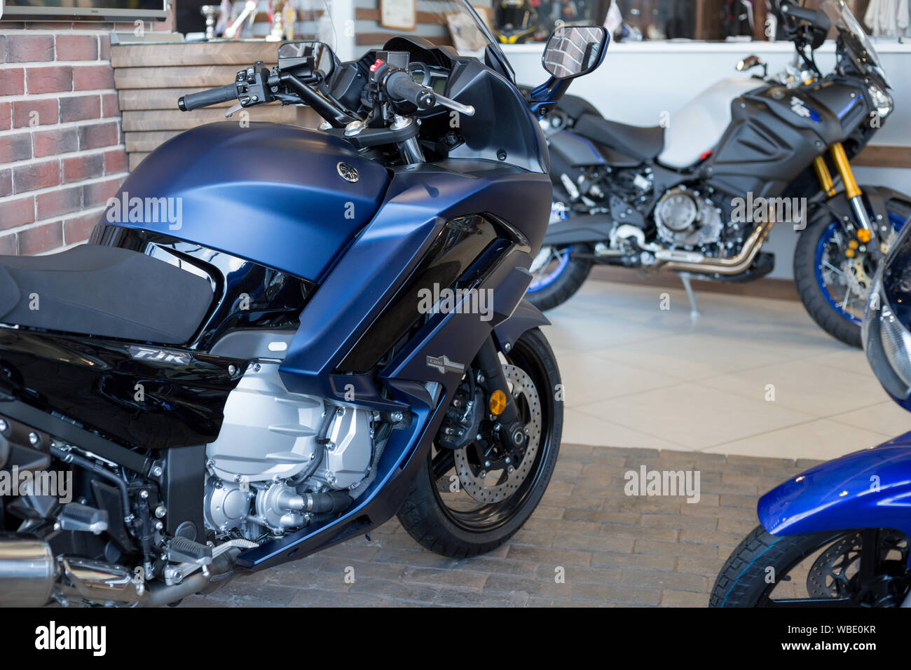 Russia, Izhevsk - August 23, 2019: Yamaha motorcycle shop. New motorbikes in modern motorcycle store. Famous world brand. Stock Photo