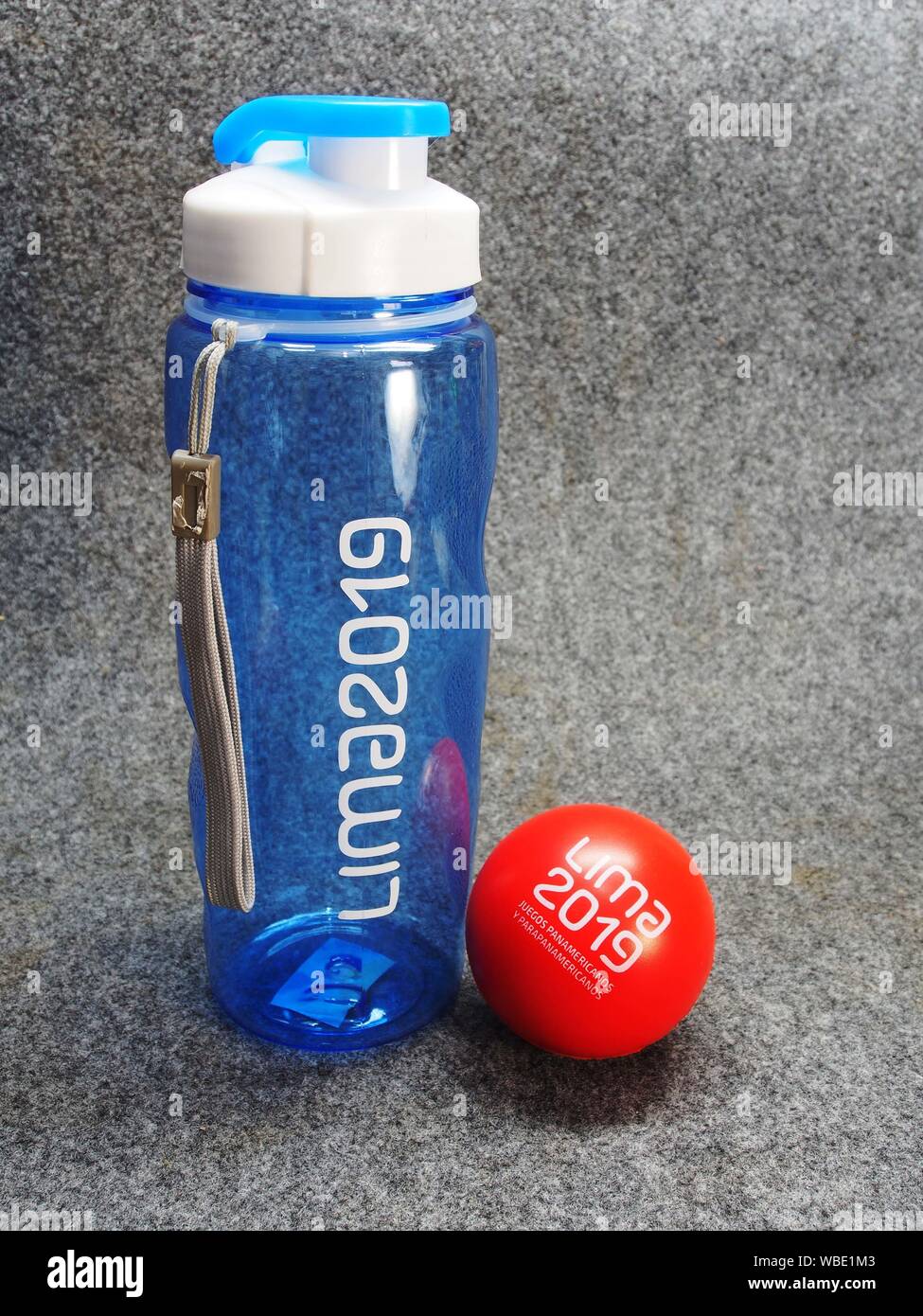 Bottle, and red rubber ball, souvenirs of the   Lima 2019 Pan American and Parapan American Games Stock Photo