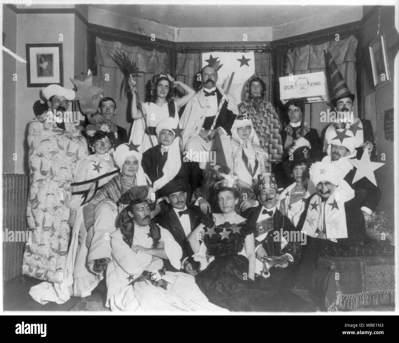 Frances Benjamin Johnston, with friends at costume party, bottom center Abstract/medium: 1 photographic print. Stock Photo