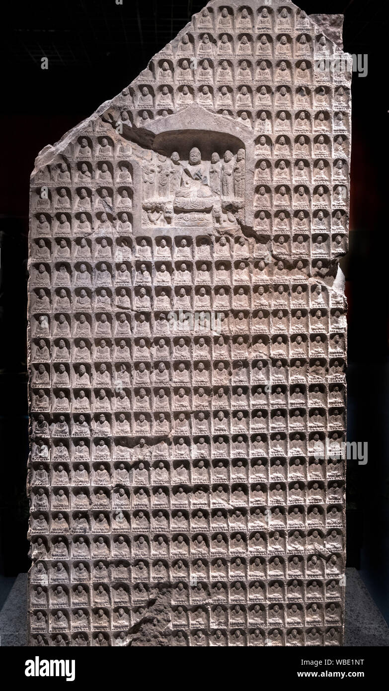 Carved stone Thousand Buddha stele, Northern Zhou dynasty (557-581 AD) Stock Photo