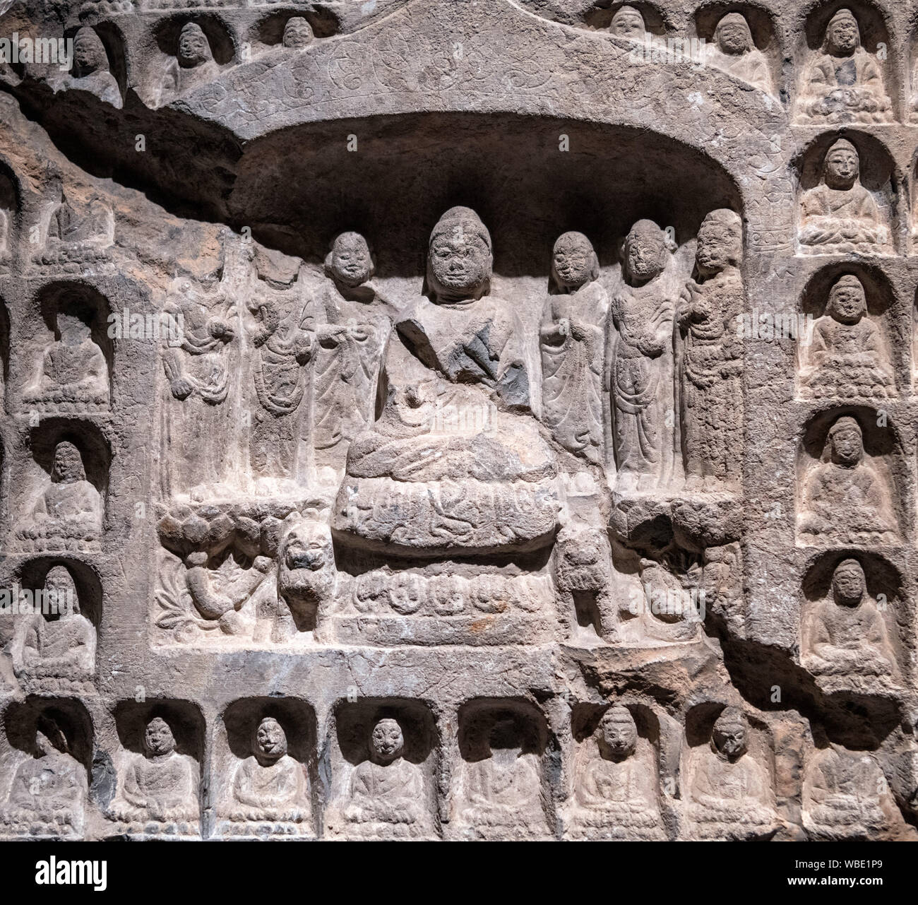 Detail from a carved stone Thousand Buddha stele, Northern Zhou dynasty (557-581 AD) Stock Photo