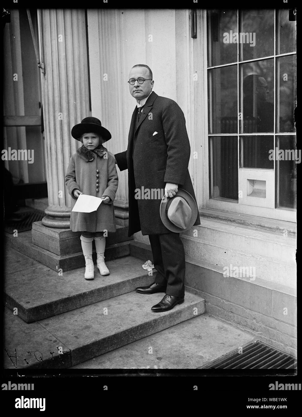 Frances Glover and her father third [...] P.M.G. Glover. Miss Glover presented Pres. Harding with the first of three new [...] one portraying the Arlington amphitheater Abstract/medium: 1 negative : glass ; 4 x 5 in. or smaller Stock Photo