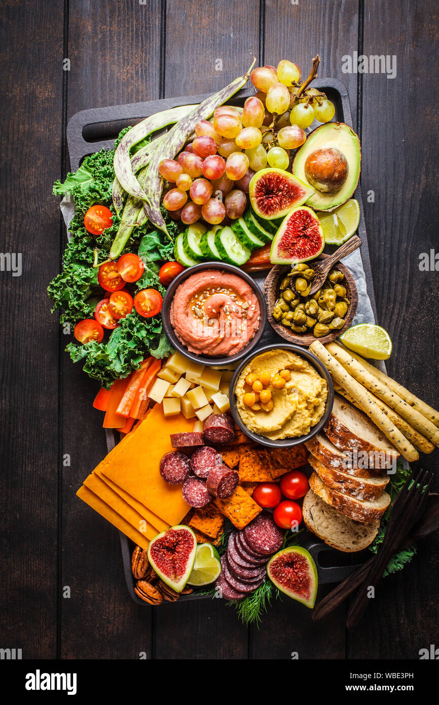 Meat and Cheese appetizer Platter. Sausage, cheese, hummus, vegetables