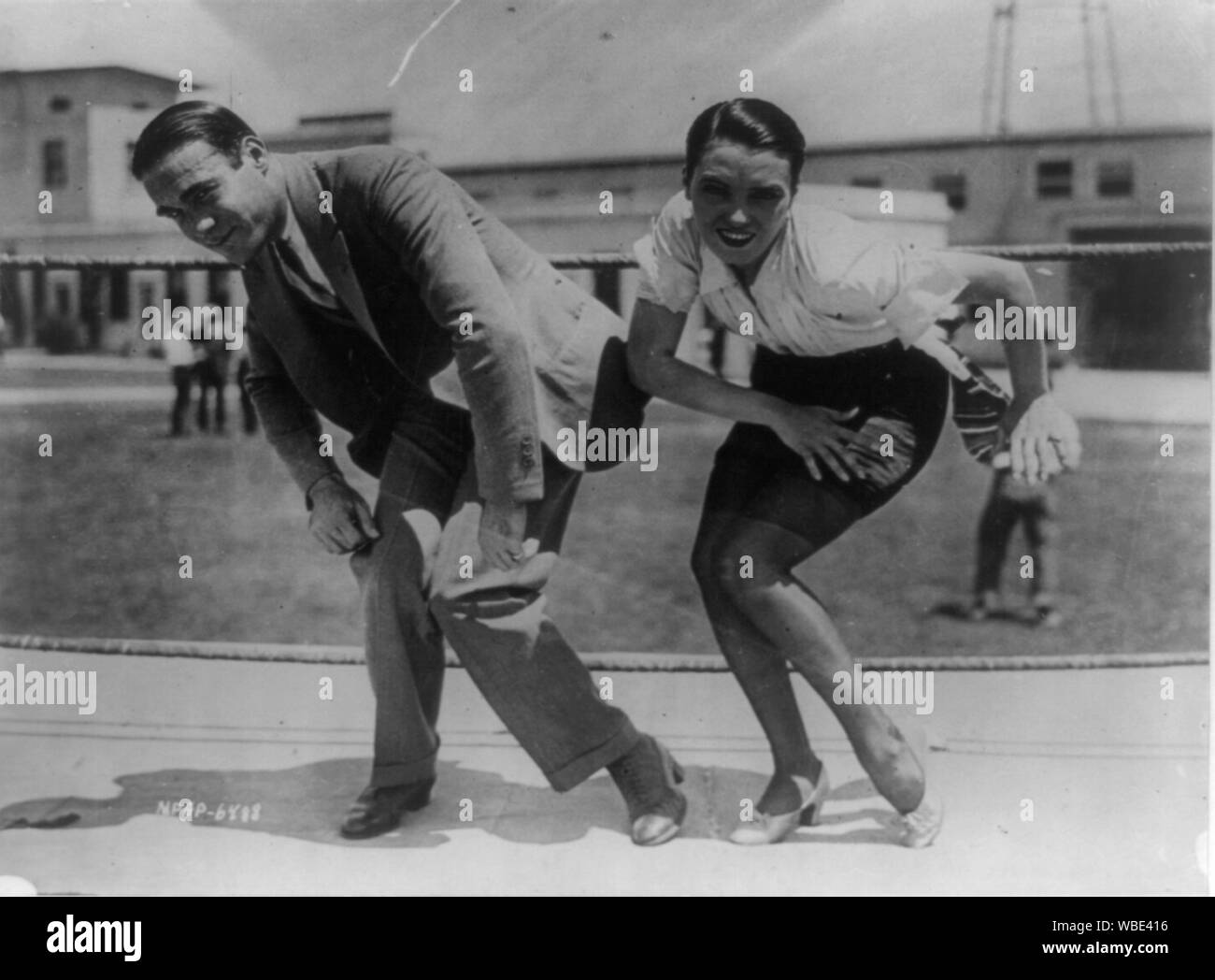 Frank Farnum coaching Pauline Starke. And now the Charleston is moving into the movies! Pauline Starke will introduce it to the movie public at large when in the role of a chorus girl in Metro-Goldwyn-Mayer's A Little bit of Broadway, she performs it on the screen. Frank Farnum, originator of the step, gave her first-hand (or foot) instructions Abstract/medium: 1 photographic print. Stock Photo