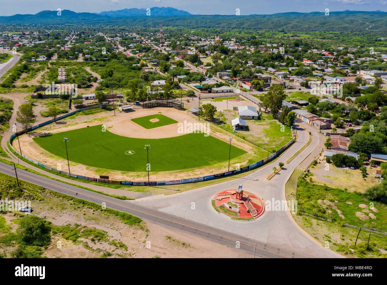 Aerial view of the statue or monument of the famous horse, El Moro de Cumpas and baseball stadium at the entrance of the town of Cumpas, Sonora, Mexico. Route of the Sierra in Sonora Mexico. located in the lower region of the Sierra Madre Occidente. It was founded in 1643 by the Jesuit missionary Egidio Monteffio under the name of Our Lady of the Assumption of Cumpas, with the purpose of evangelizing the Opal tribes that inhabited that place in the previous times and during the conquest.  (© Photo: LuisGutierrez / NortePhoto.com)  Vista aerea de la estatua o monumento del famoso caballo , El M Stock Photo