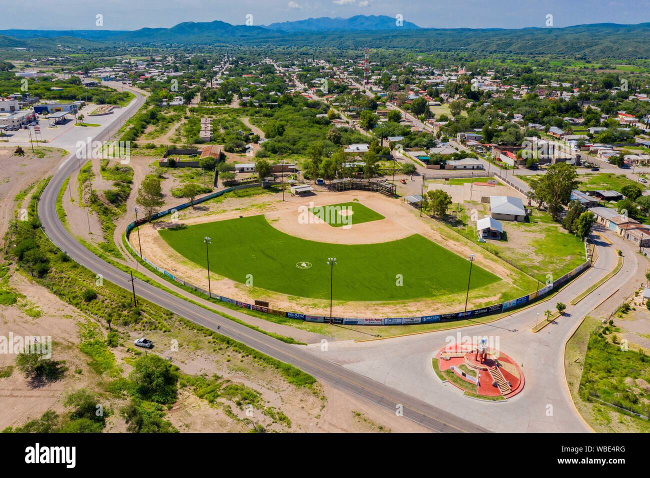 Aerial view of the statue or monument of the famous horse, El Moro de Cumpas and baseball stadium at the entrance of the town of Cumpas, Sonora, Mexico. Route of the Sierra in Sonora Mexico. located in the lower region of the Sierra Madre Occidente. It was founded in 1643 by the Jesuit missionary Egidio Monteffio under the name of Our Lady of the Assumption of Cumpas, with the purpose of evangelizing the Opal tribes that inhabited that place in the previous times and during the conquest.  (© Photo: LuisGutierrez / NortePhoto.com)  Vista aerea de la estatua o monumento del famoso caballo , El M Stock Photo