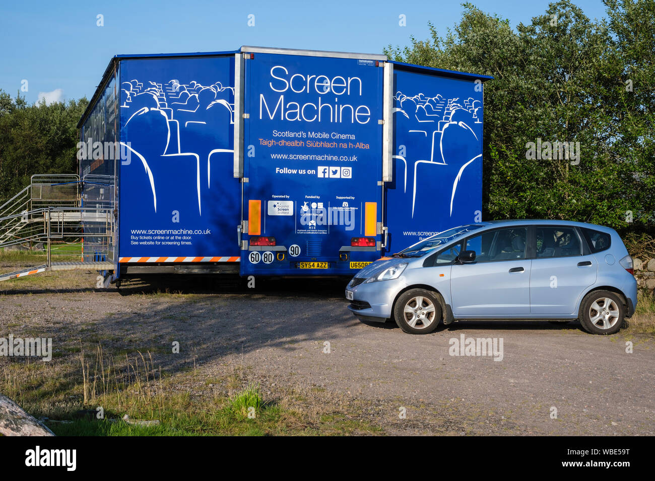 Screen Machine, mobile cinema, touring Highlands & Islands of Scotland. Parked at Battery Park, Lochcarron village, for screening of films. Stock Photo